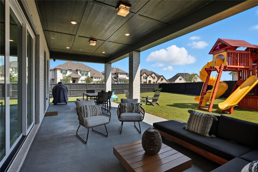 Amazing oversized covered patio. View from right corner overlooking back yard. Amazing oversized covered patio. View from right corner overlooking back yard.