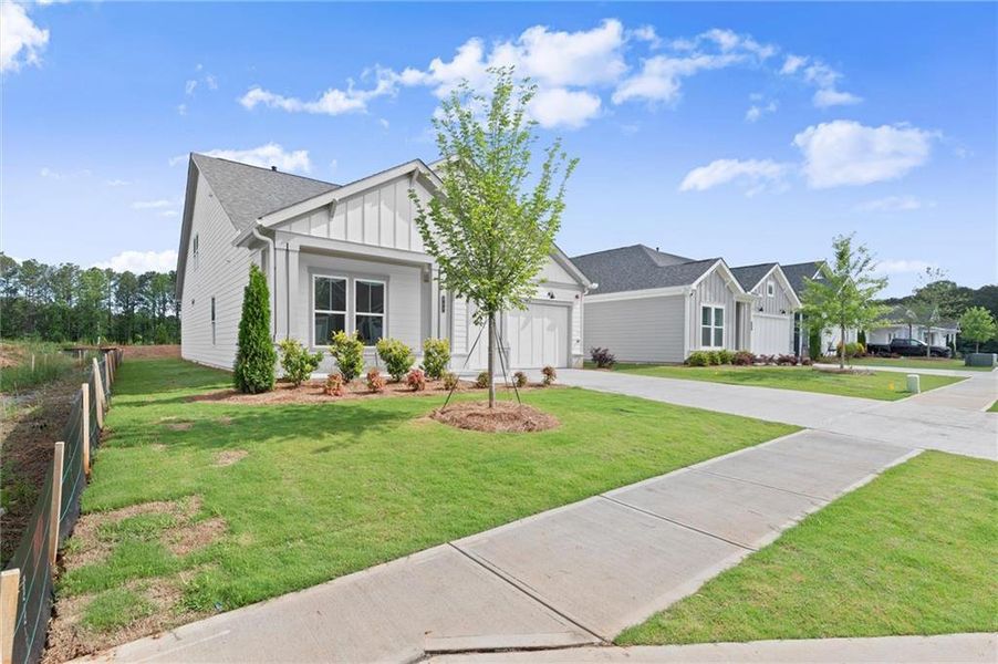 Front exterior of a new home in , Kennesaw, GA, highlighting curb appeal (Image 27).