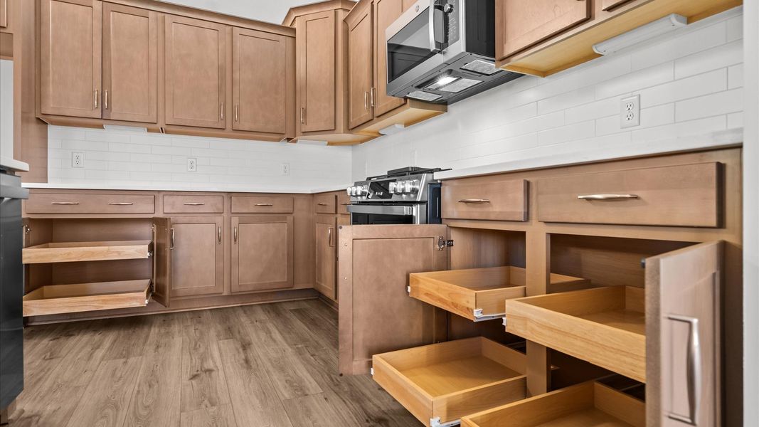 Elegant kitchen with large island in this first-class DRB Homes design