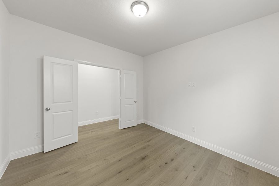 Spacious, unfurnished interior of a new home in The Reserve at Spiritas Ranch, Little Elm (Image 24).