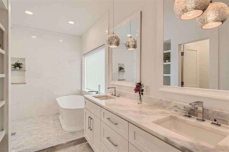 Primary Bath with double vanity, stand alone tub and rain shower!