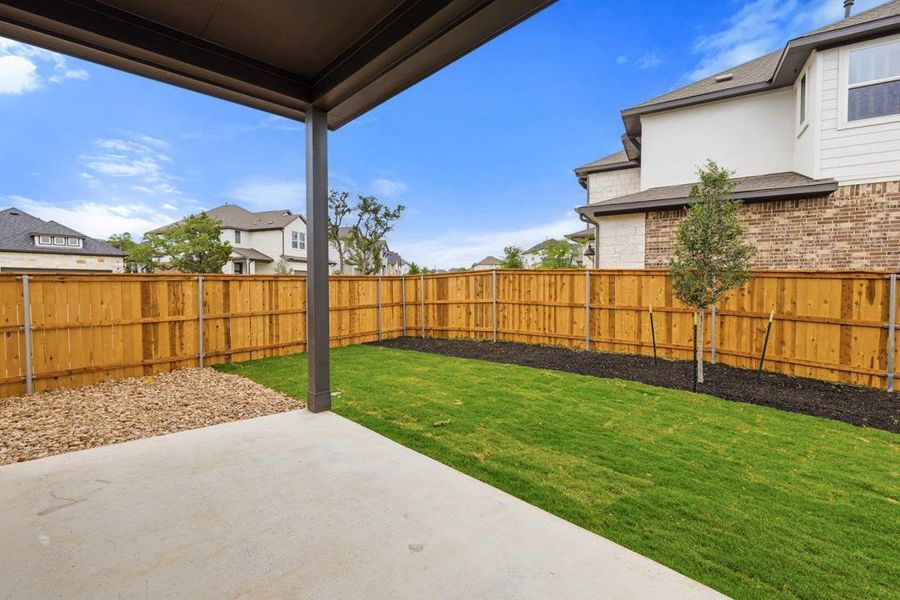 Exterior details and patio area of a home in Heritage, Dripping Springs (Image 22).