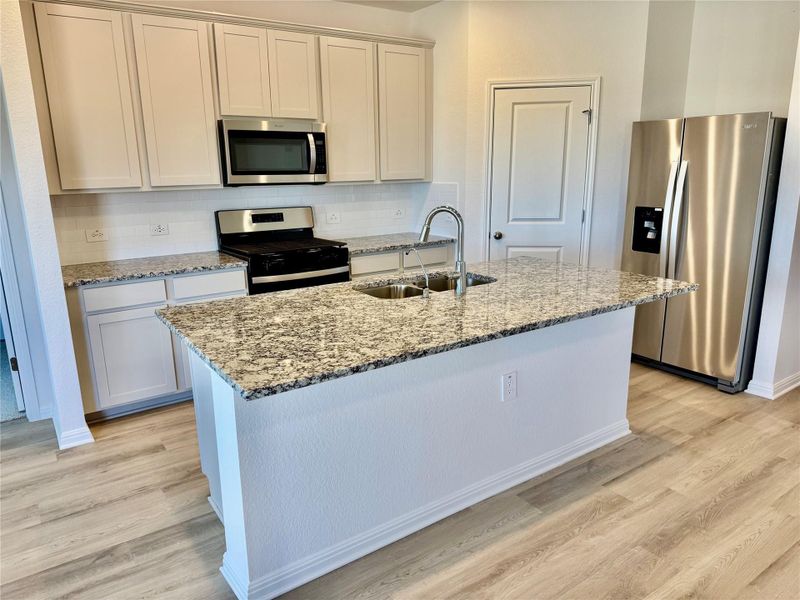 Furnished interior view inside a new home in Lexington Parke, Del Valle (Image 5).