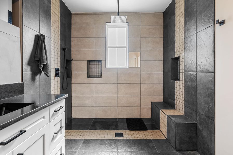 Bathroom with walk in shower and vanity