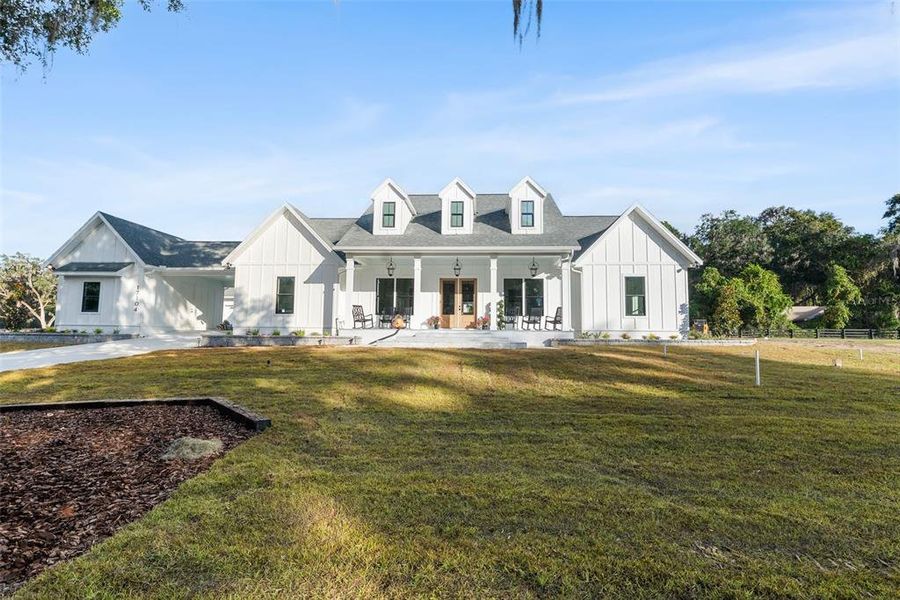 Front exterior of a new home in , Newberry, FL, highlighting curb appeal (Image 29). Front exterior of a new home in , Newberry, FL, highlighting curb appeal (Image 29).