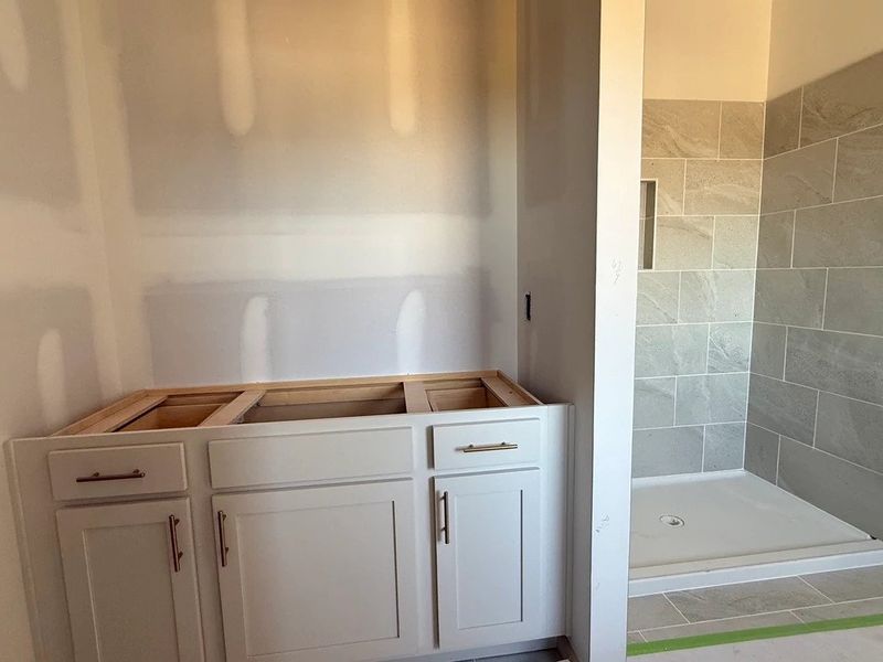 Primary Bath featuring the AW Collection® Serene - Clean forms offer quiet luxury.