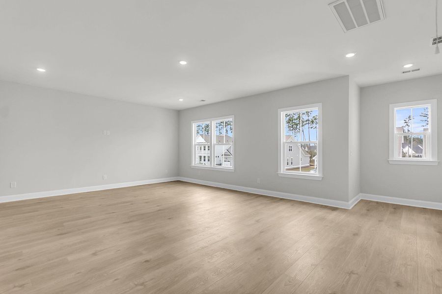 Spacious, unfurnished interior of a new home in Tidewater at Lakes of Cane Bay, Summerville (Image 48).