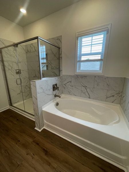 This bathroom features elegant tile work and a lux