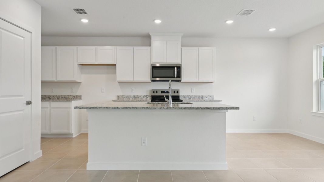Kitchen of the Coronado - End at Cyrene at Harmony located in St Cloud FL by DRB Homes
