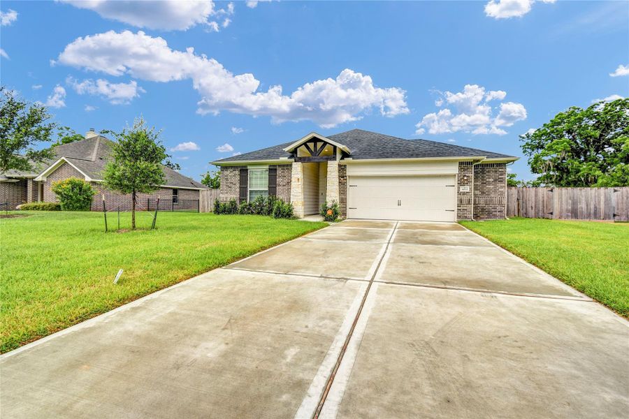 Another view of the home showcases the oversized garage Another view of the home showcases the oversized garage