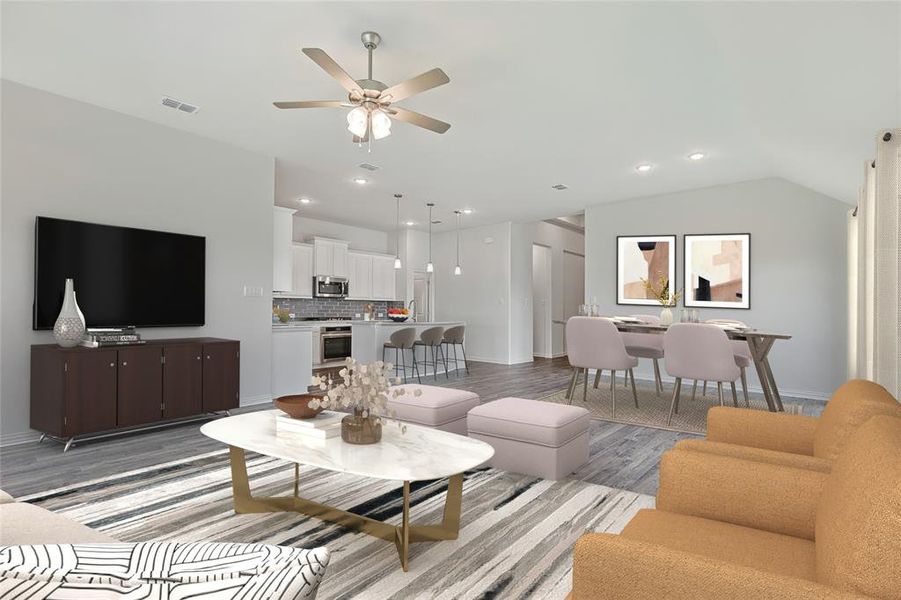 Living room featuring ceiling fan, light hardwood / wood-style floors, and lofted ceiling