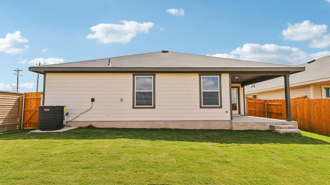 Exterior details and patio area of a home in Monarch Ranch, Manor (Image 17).