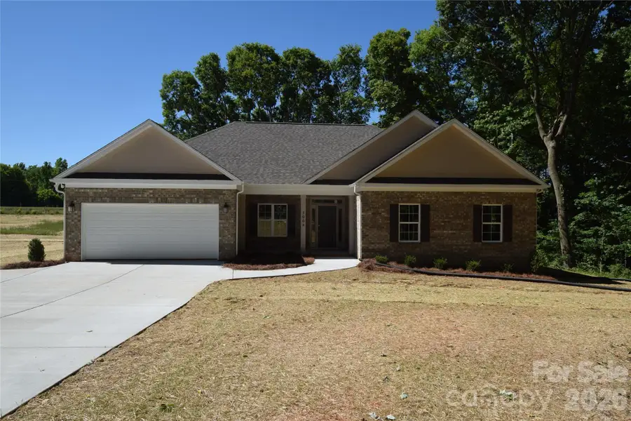Front exterior of a new home in , Monroe, NC, highlighting curb appeal (Image 1). Front exterior of a new home in , Monroe, NC, highlighting curb appeal (Image 1).