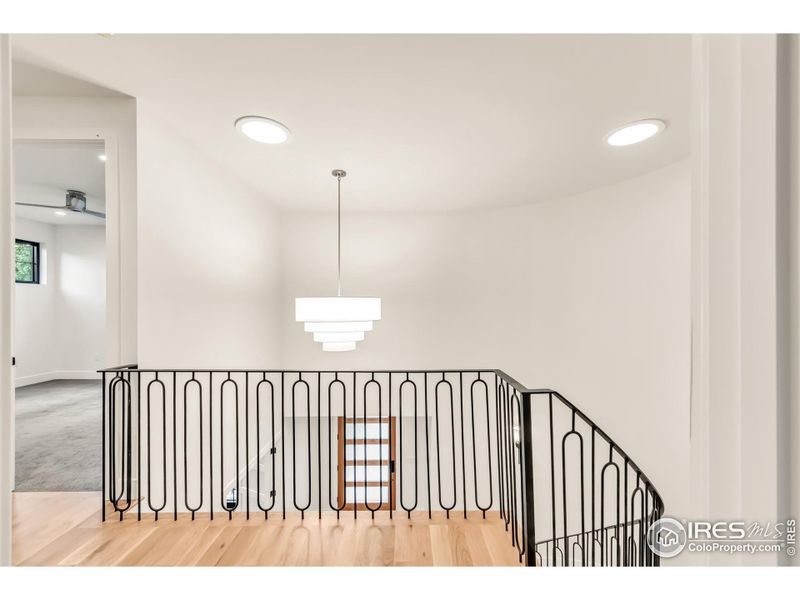 Upper landing is open to the entry; stunning chandelier and two solar tubes for additional sunlight