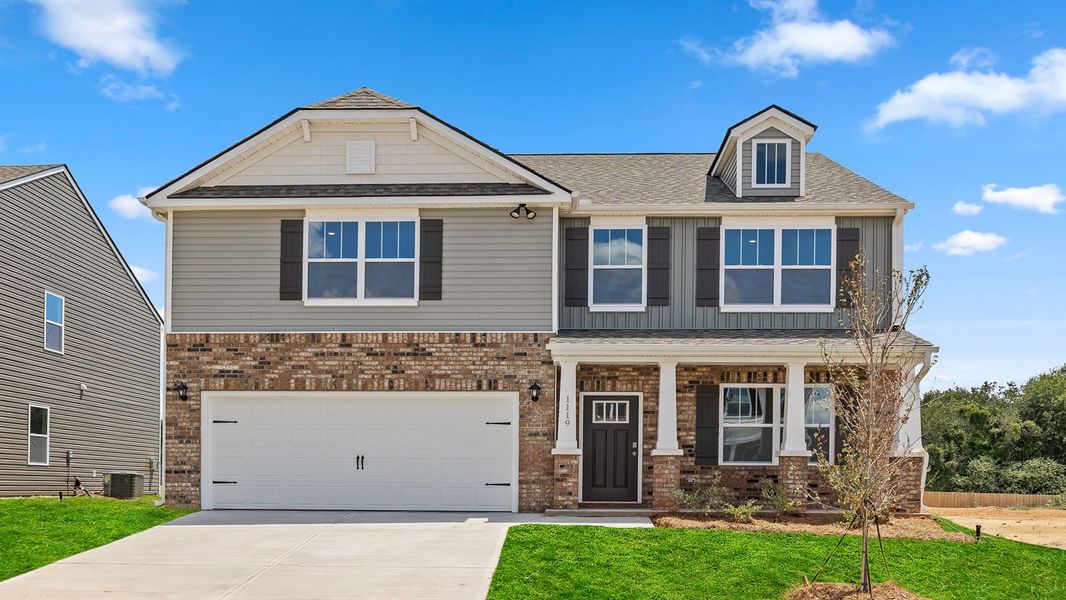 Front exterior of a new home in Waverly Station, Greenwood, SC, highlighting curb appeal (Image 1).