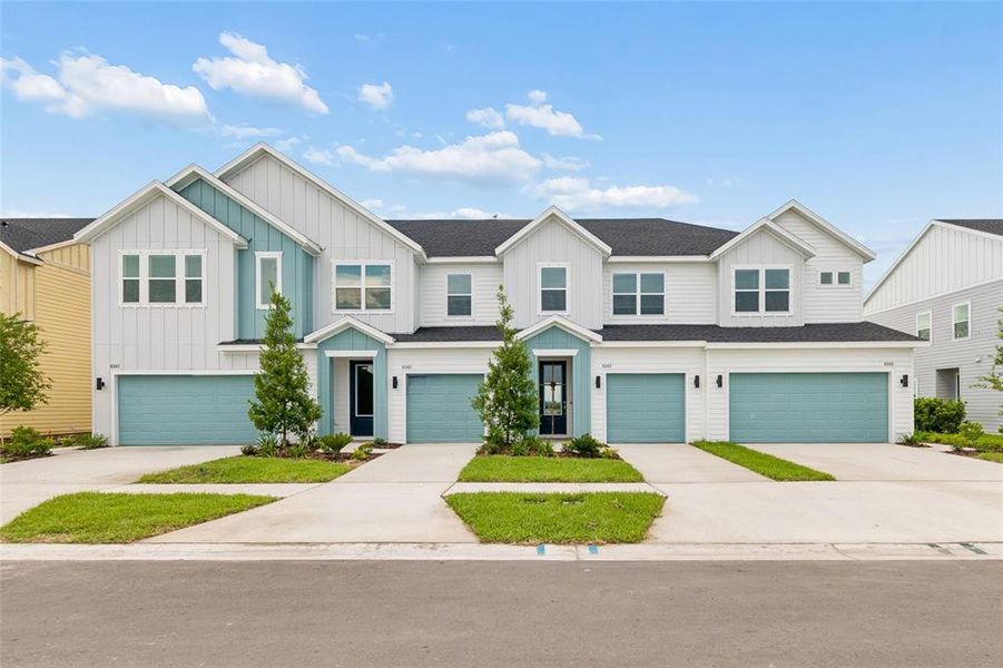 Front exterior of a new home in Waterset Townhomes, Apollo Beach, FL, highlighting curb appeal (Image 2). Front exterior of a new home in Waterset Townhomes, Apollo Beach, FL, highlighting curb appeal (Image 2).