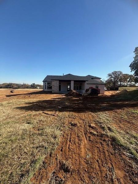 Elevated lot view of the back of the home. This area could be used for a nice fire pit and entertaining area or space for an additional bldg.