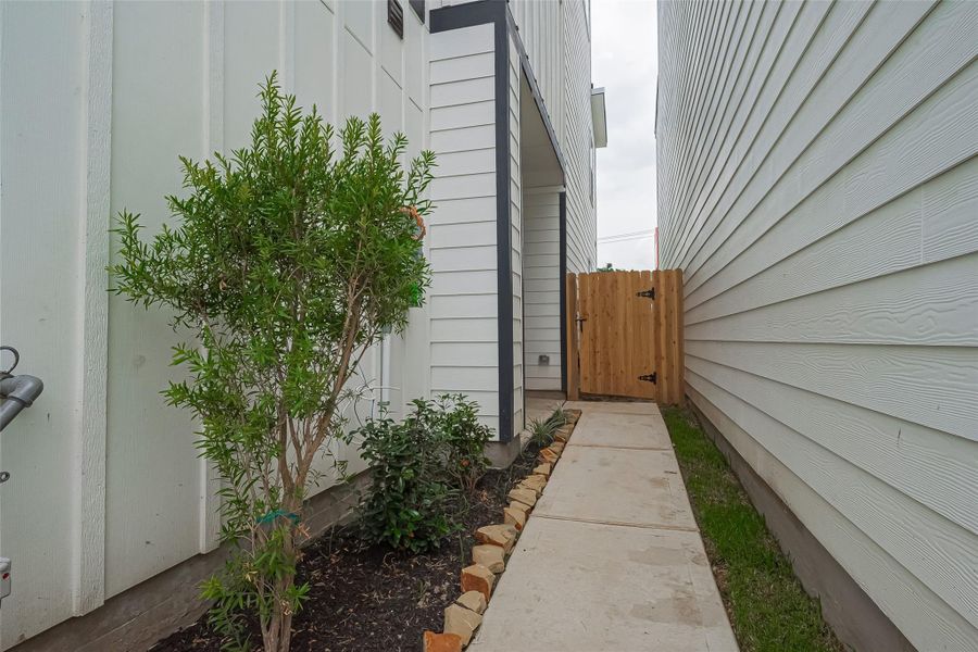 Front exterior of a new home in Regents Court, Houston, TX, highlighting curb appeal (Image 1). Front exterior of a new home in Regents Court, Houston, TX, highlighting curb appeal (Image 1).