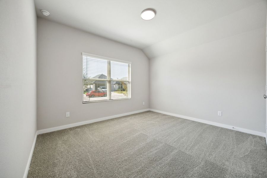 Bedroom in the Oscar home plan by Trophy Signature Homes – REPRESENTATIVE PHOTO