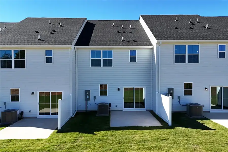 Exterior details and patio area of a home in Townes At Abner Creek, Greer (Image 2).