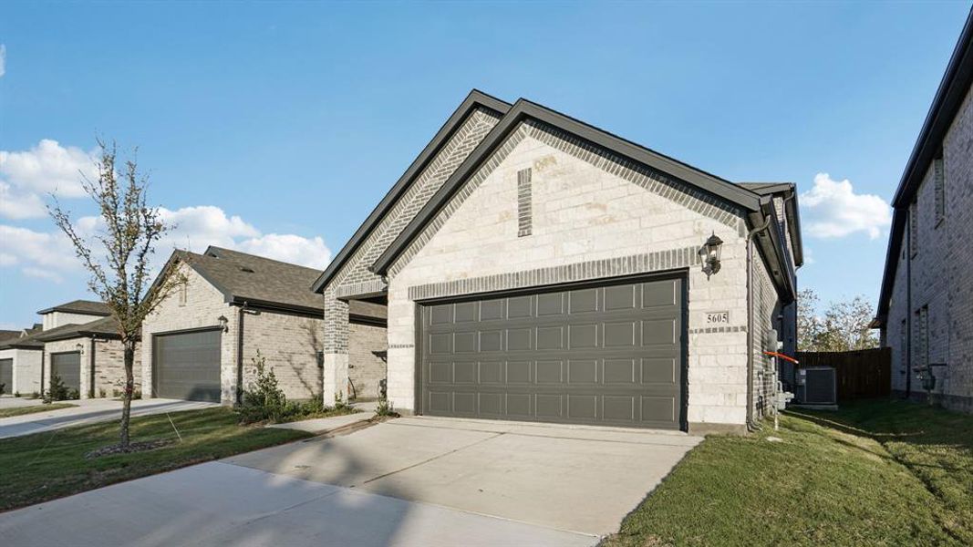 Front exterior of a new home in Eastridge - Spring Series, McKinney, TX, highlighting curb appeal (Image 2). Front exterior of a new home in Eastridge - Spring Series, McKinney, TX, highlighting curb appeal (Image 2).