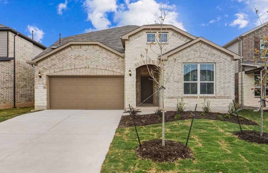 Front exterior of a new home in Lagos, Manor, TX, highlighting curb appeal (Image 19).