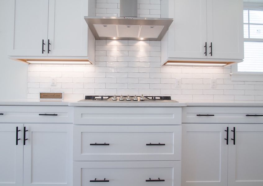 Representative furnished interior of a home built from the The Amherst by RobuckHomes in Windwater, Hampstead (Image 19).