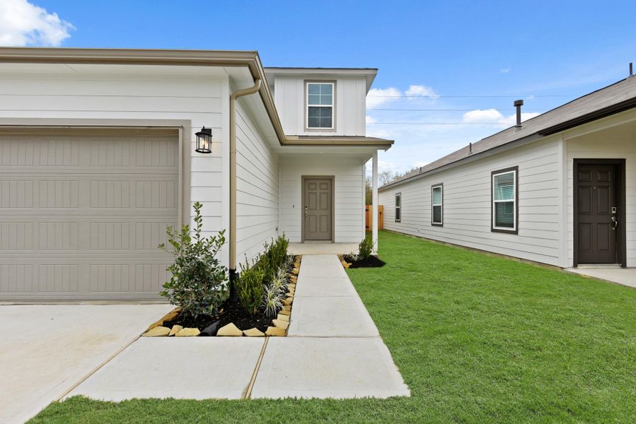 Exterior details and patio area of a home in Barrett Crossing, Crosby (Image 3).