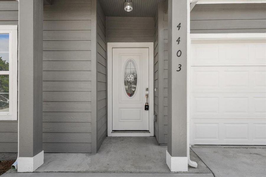 Property entrance featuring a garage