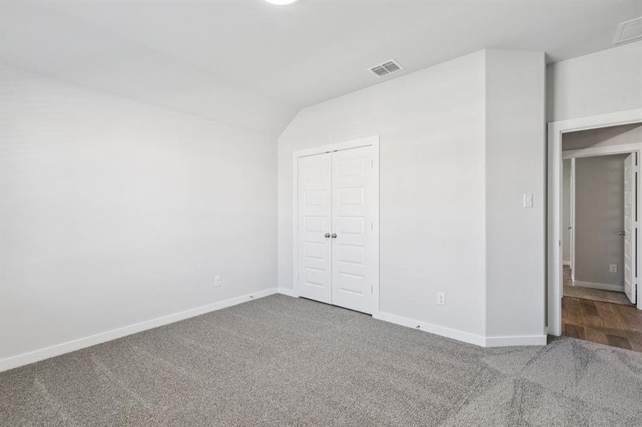Bedroom in the Oscar home plan by Trophy Signature Homes – REPRESENTATIVE PHOTO Bedroom in the Oscar home plan by Trophy Signature Homes – REPRESENTATIVE PHOTO