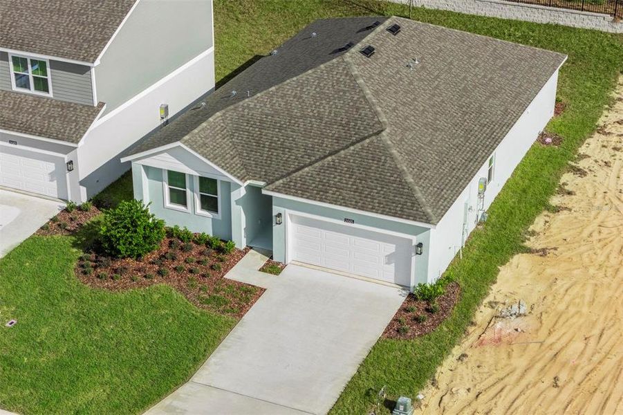 Front exterior of a home in the Hodges Reserve community, located in Howey-in-the-Hills, FL (Image 15).