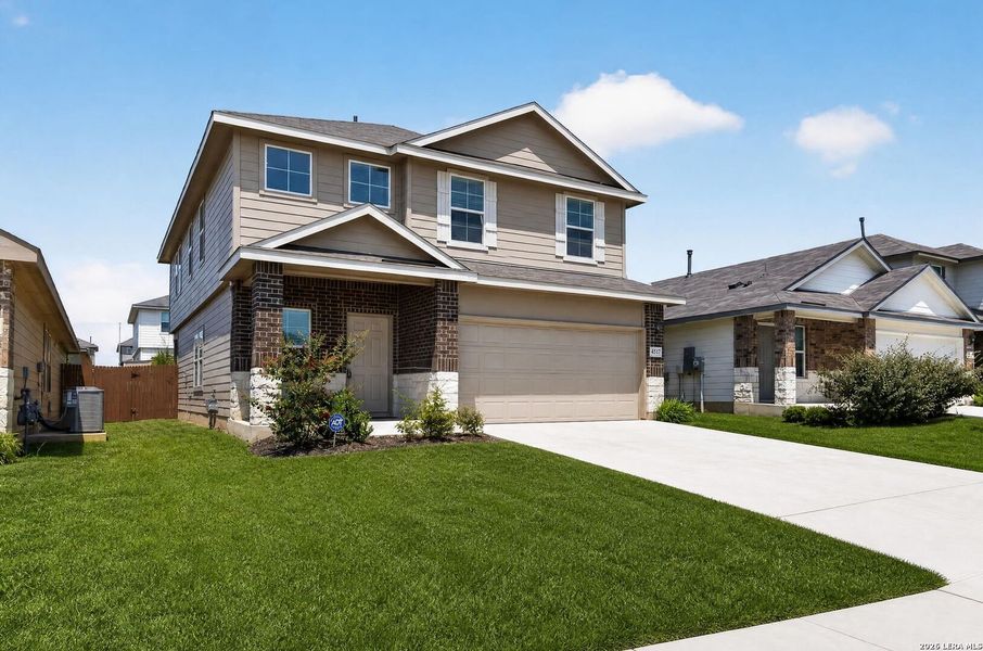 Front exterior of a new home in Avenida, Converse, TX, highlighting curb appeal (Image 2). Front exterior of a new home in Avenida, Converse, TX, highlighting curb appeal (Image 2).