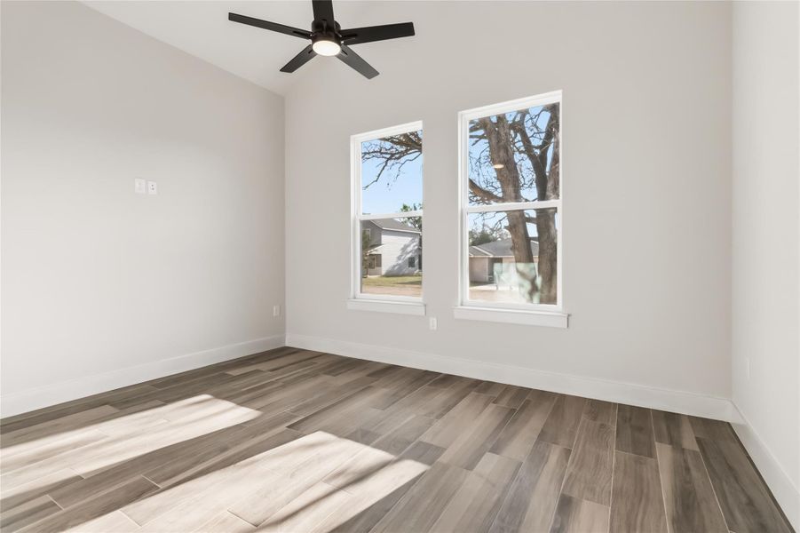 Dedicated office with cathedral ceilings on main level without virtual staging