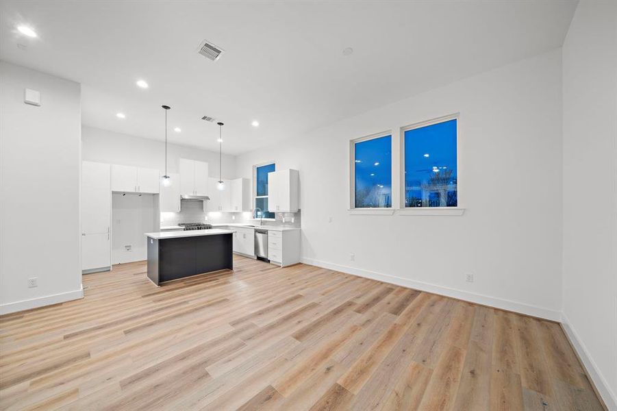 A view back through your living room toward your kitchen and dining are.