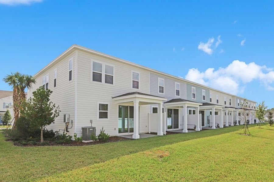 Exterior details and patio area of a home in Cherry Elm at SilverLeaf, St. Augustine (Image 17).