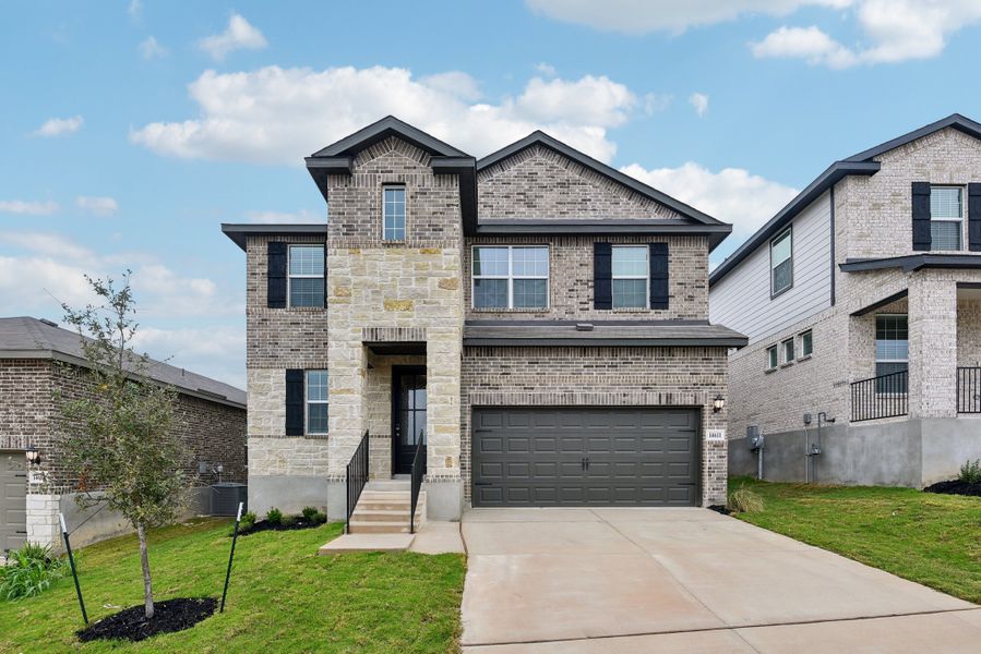 Front exterior of the Red River floorplan at a Meritage Homes community.