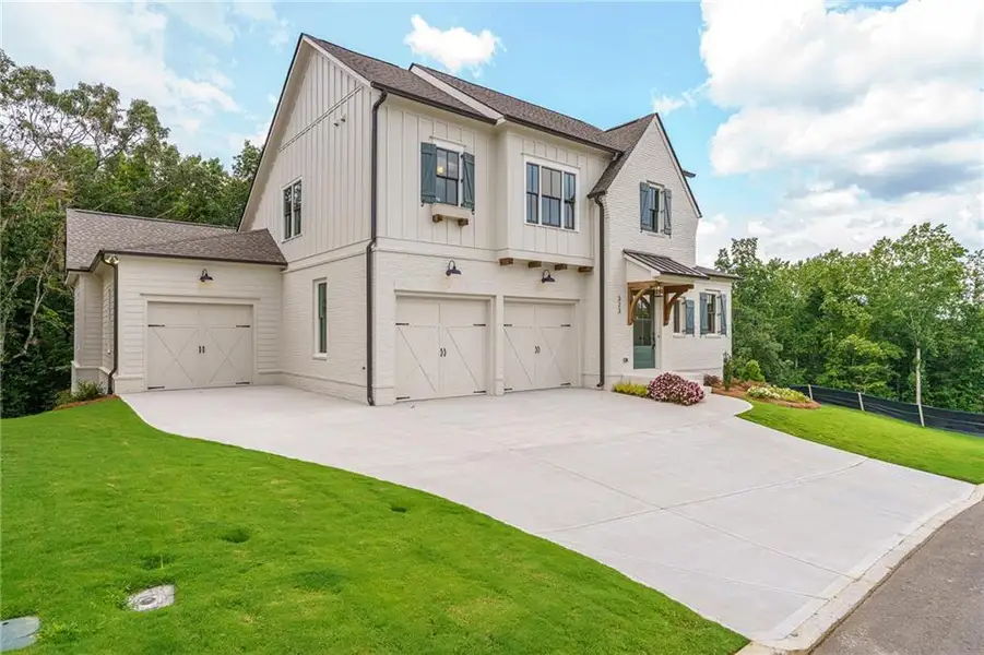 Front exterior of a new home in Malone's Pond, Ball Ground, GA, highlighting curb appeal (Image 18).