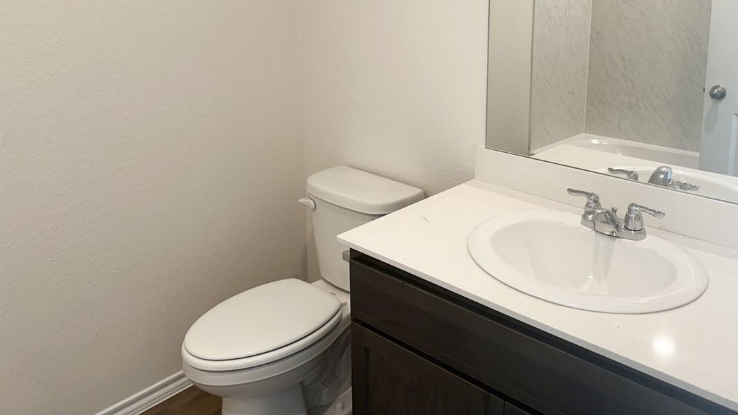 Representative furnished interior of a home built from the MIDLAND by D.R. Horton in Northspur, Forney (Image 9).