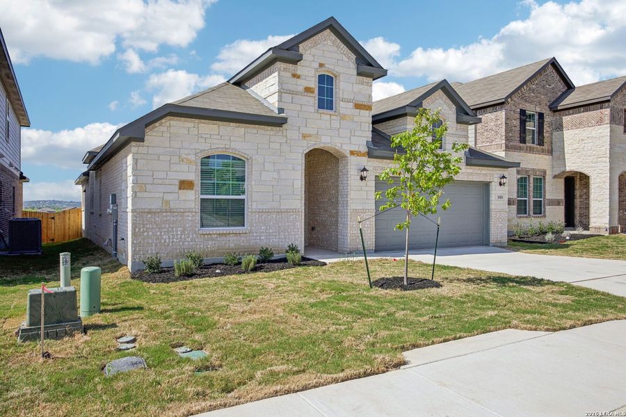 Front exterior of a new home in Sagebrooke - Classic Series, San Antonio, TX, highlighting curb appeal (Image 24).