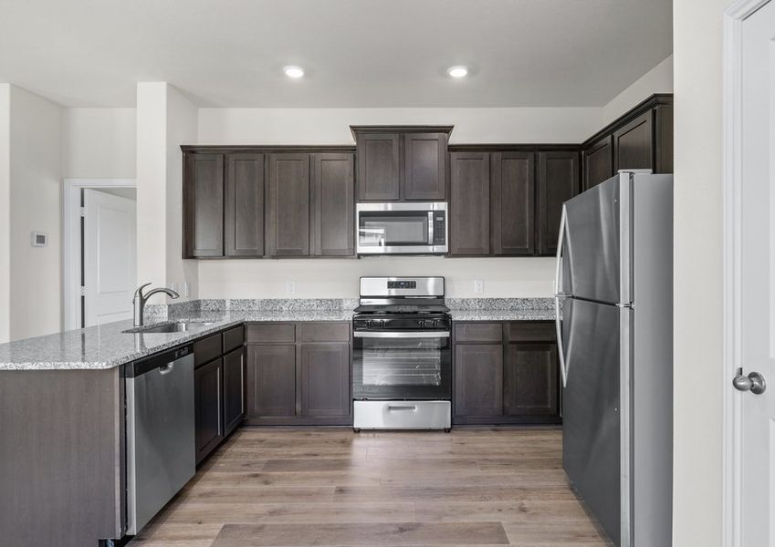 The kitchen has energy-efficient, stainless-steel appliances.