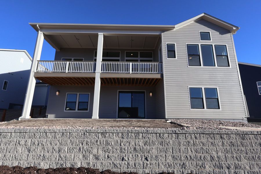 Exterior details and patio area of a home in Cloverleaf - Pinnacle Collection, Monument (Image 3).
