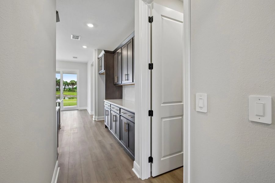 As you continue down the hall you walk into the kitchen space