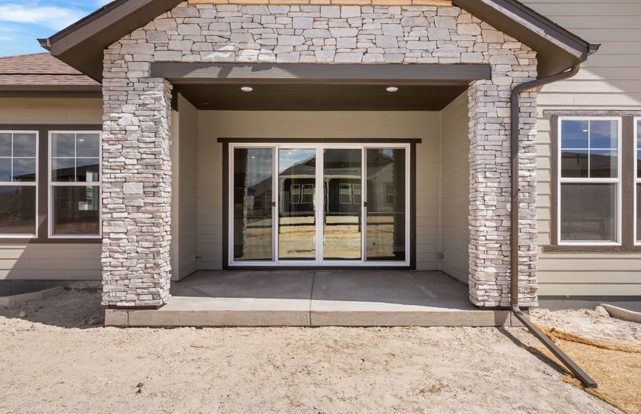 Exterior details and patio area of a home in Hilltop at Inspiration, Aurora (Image 4).