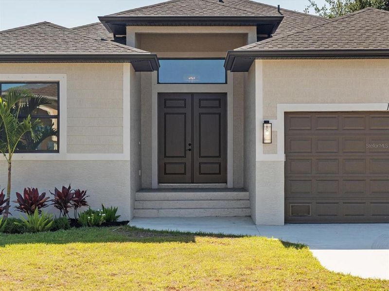 Front exterior of a new home in , Port Charlotte, FL, highlighting curb appeal (Image 24).