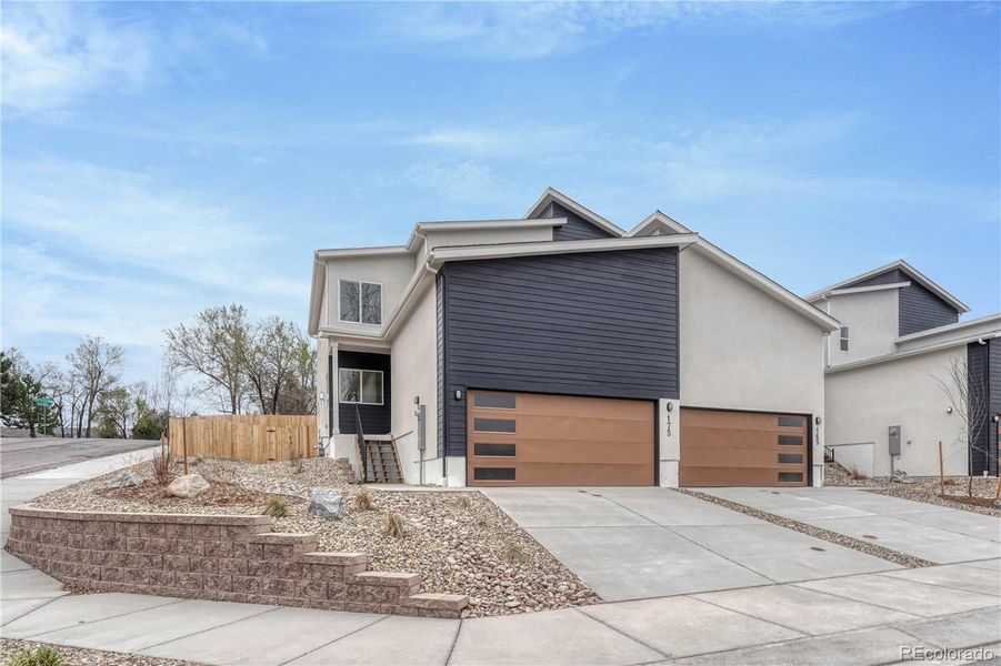 Front exterior of a new home in , Colorado Springs, CO, highlighting curb appeal (Image 17). Front exterior of a new home in , Colorado Springs, CO, highlighting curb appeal (Image 17).