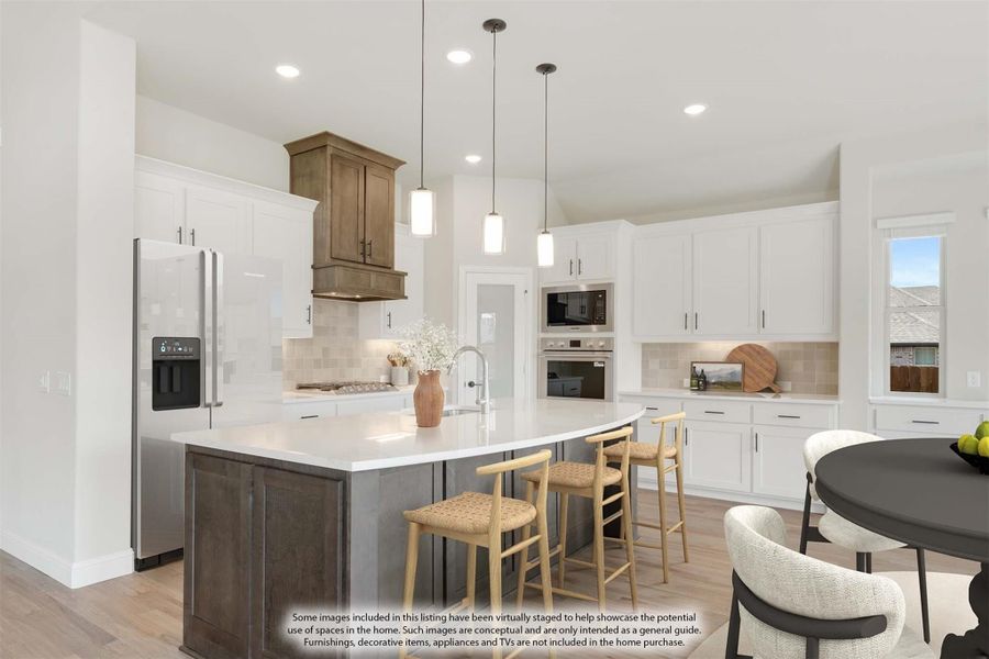 Kitchen with white cabinets, wood range hood, large island with seating, and stainless steel appliances Kitchen with white cabinets, wood range hood, large island with seating, and stainless steel appliances