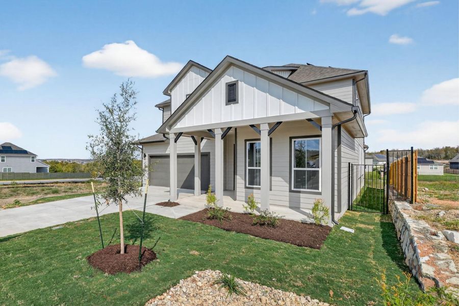 Modern farmhouse featuring a porch, board and batten siding, driveway, and a garage Modern farmhouse featuring a porch, board and batten siding, driveway, and a garage