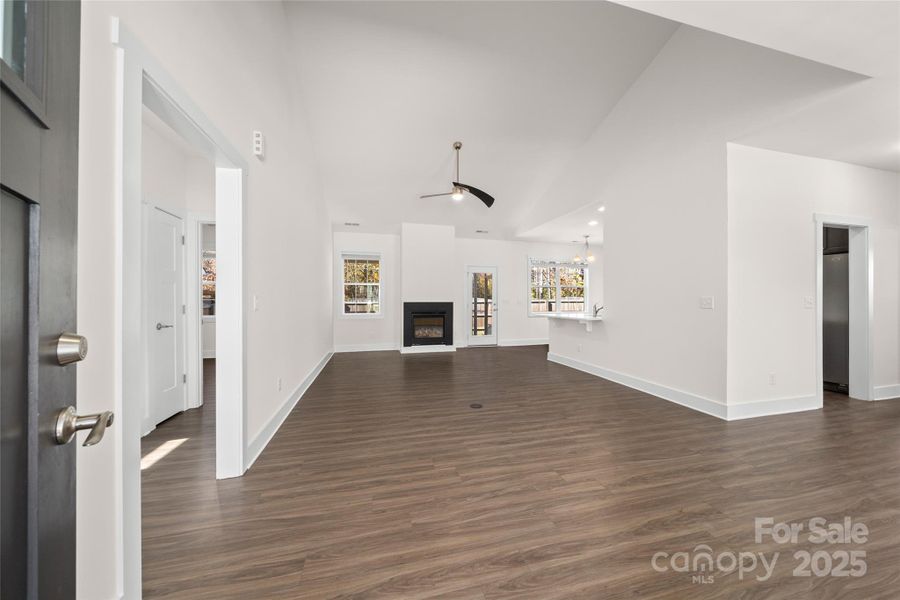 Open floor plan featuring gas log fireplace. Open floor plan featuring gas log fireplace.