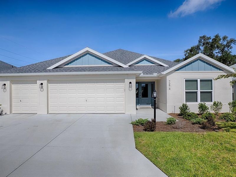 Front exterior of a new home in , The Villages, FL, highlighting curb appeal (Image 25). Front exterior of a new home in , The Villages, FL, highlighting curb appeal (Image 25).