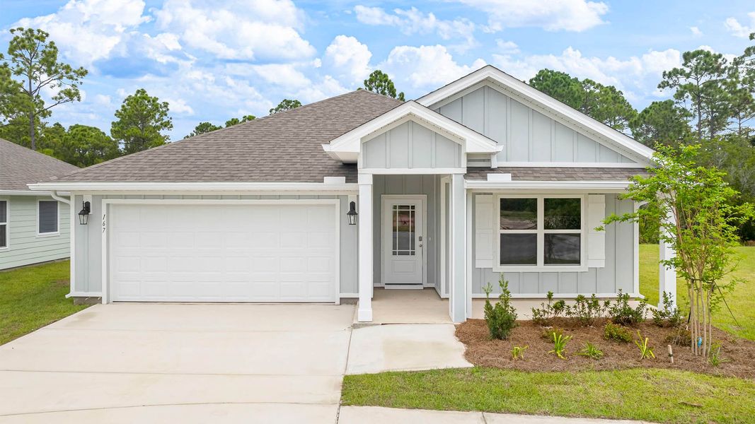 Front exterior of a new home in Palmetto Bluff, Port Saint Joe, FL, highlighting curb appeal (Image 1).